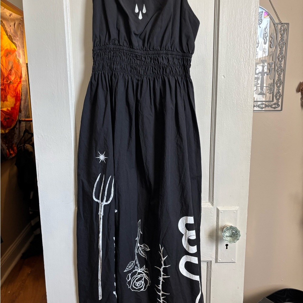 Black Sleeveless Dress with White Graphic Design